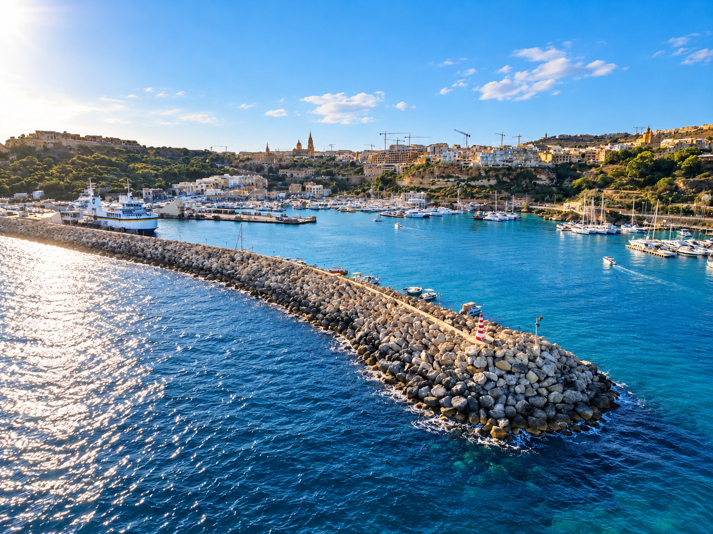 Panoramic aerial view of Mgarr harbour and breakwater